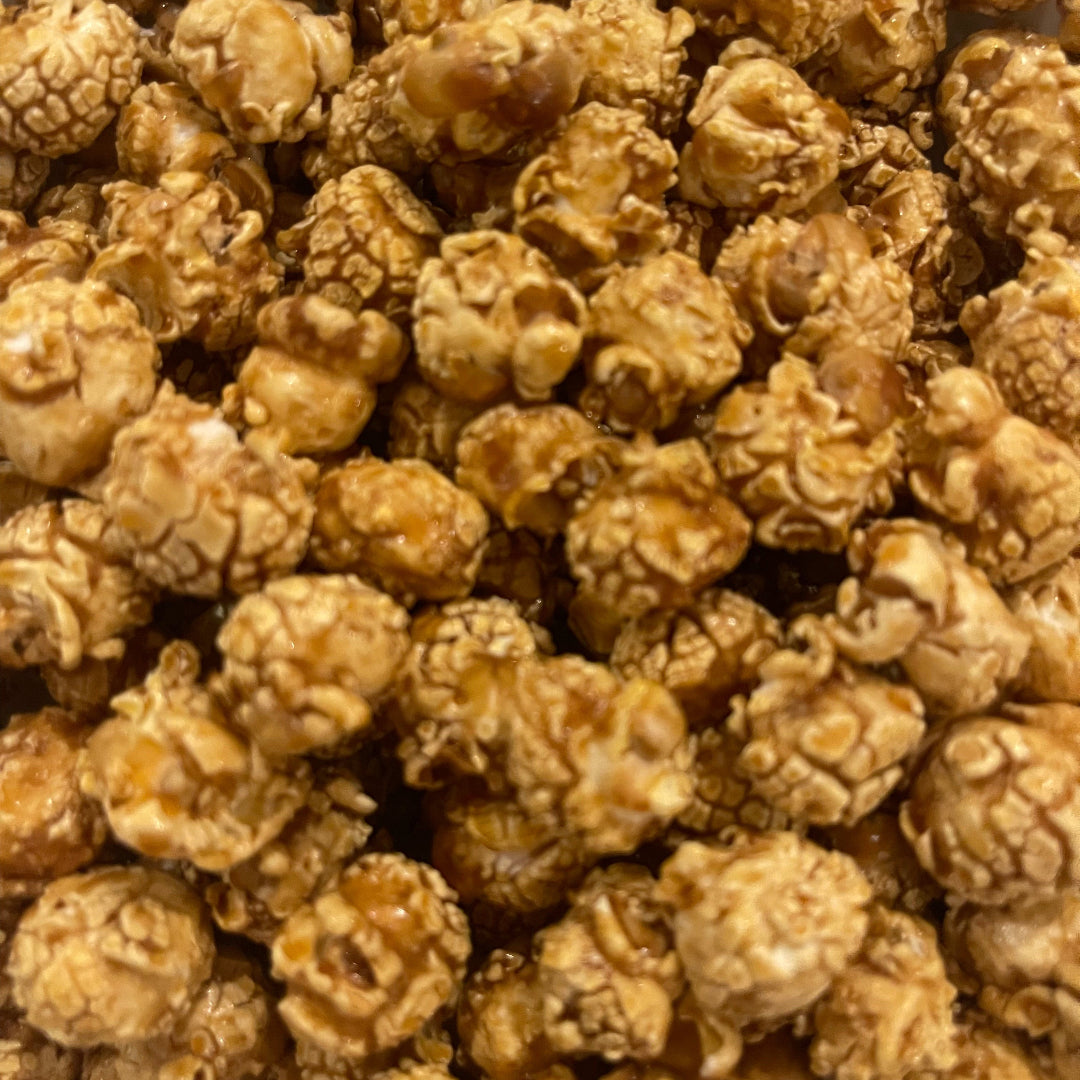 Close-up of PopCornaa 100% clean, dairy free gingerbread popcorn on a white background