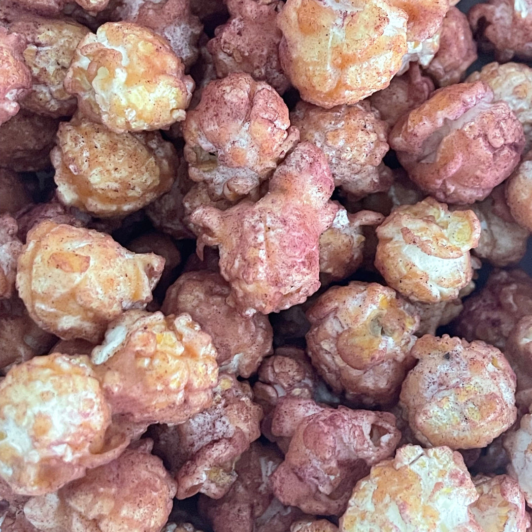 PopCornaa close up on 100% clean, dairy free strawberry, lychee and hibiscus popcorn