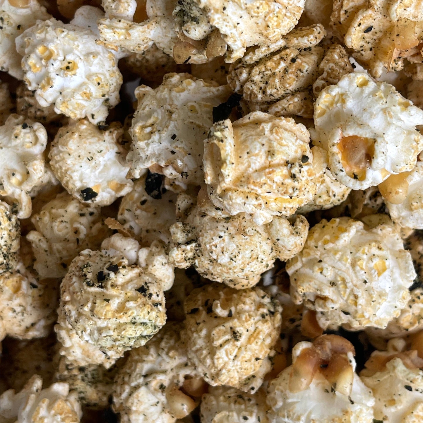 PopCorna close-up of seaweed, wasabi and soy popcorn with visible soy and seaweed seasonings