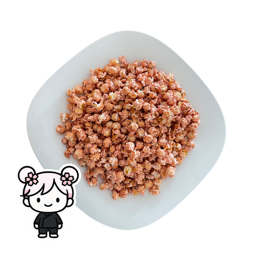 PopCornaa Pink Litchi x Strawbibi popcorn on a white plate with a cartoon character icon in the corner.