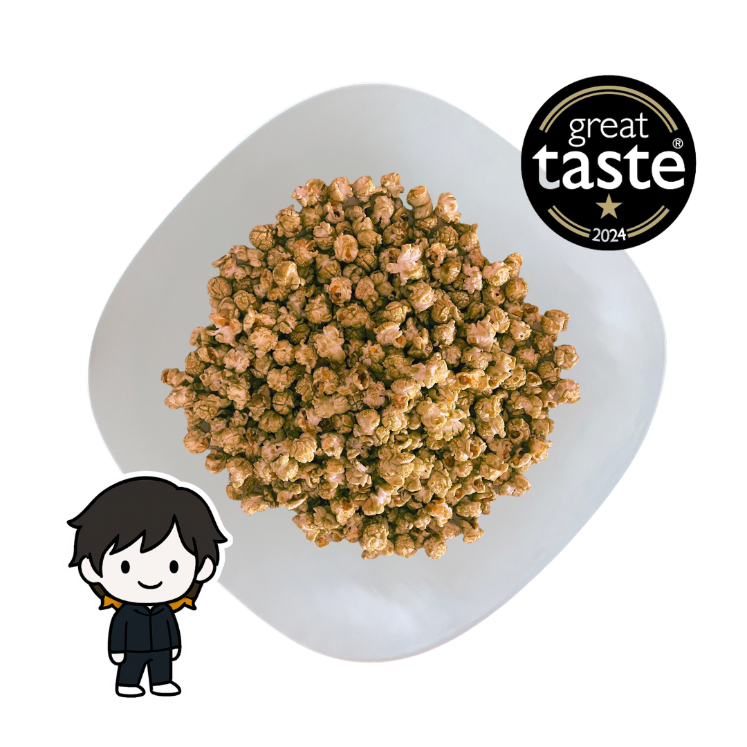 PopCornaa plate of Caramel popcorn with 'Great Taste' award logo on a white background