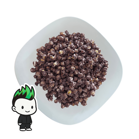 PopCornaa Chocolate Mint -covered popcorn on a white plate with a small cartoon character in the corner.
