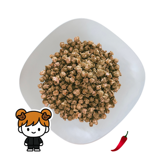 PopCornaa Gingerbread popcorn on a white plate with a cartoon character and red pepper icon.
