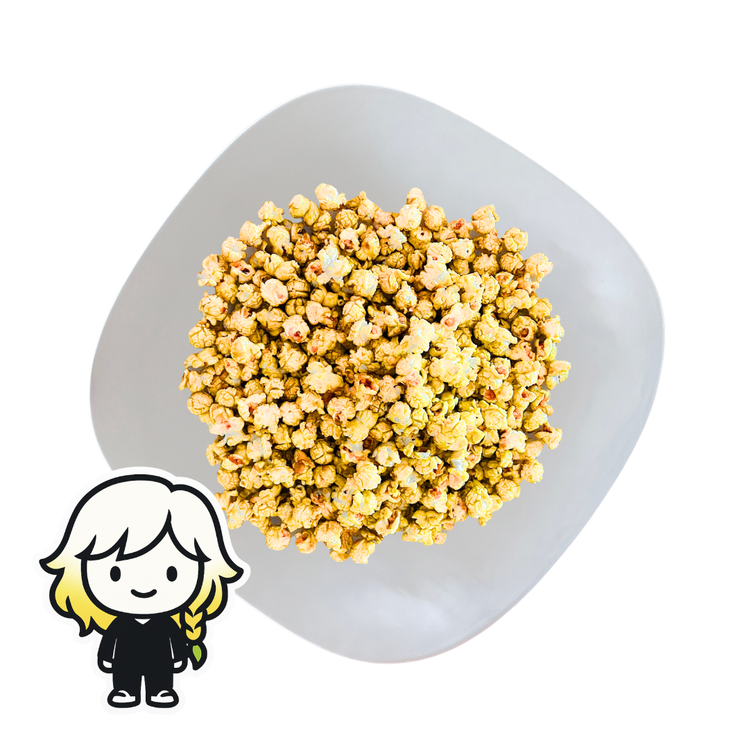 PopCornaa White plate with Mango popcorn and a small cartoon character on a white background