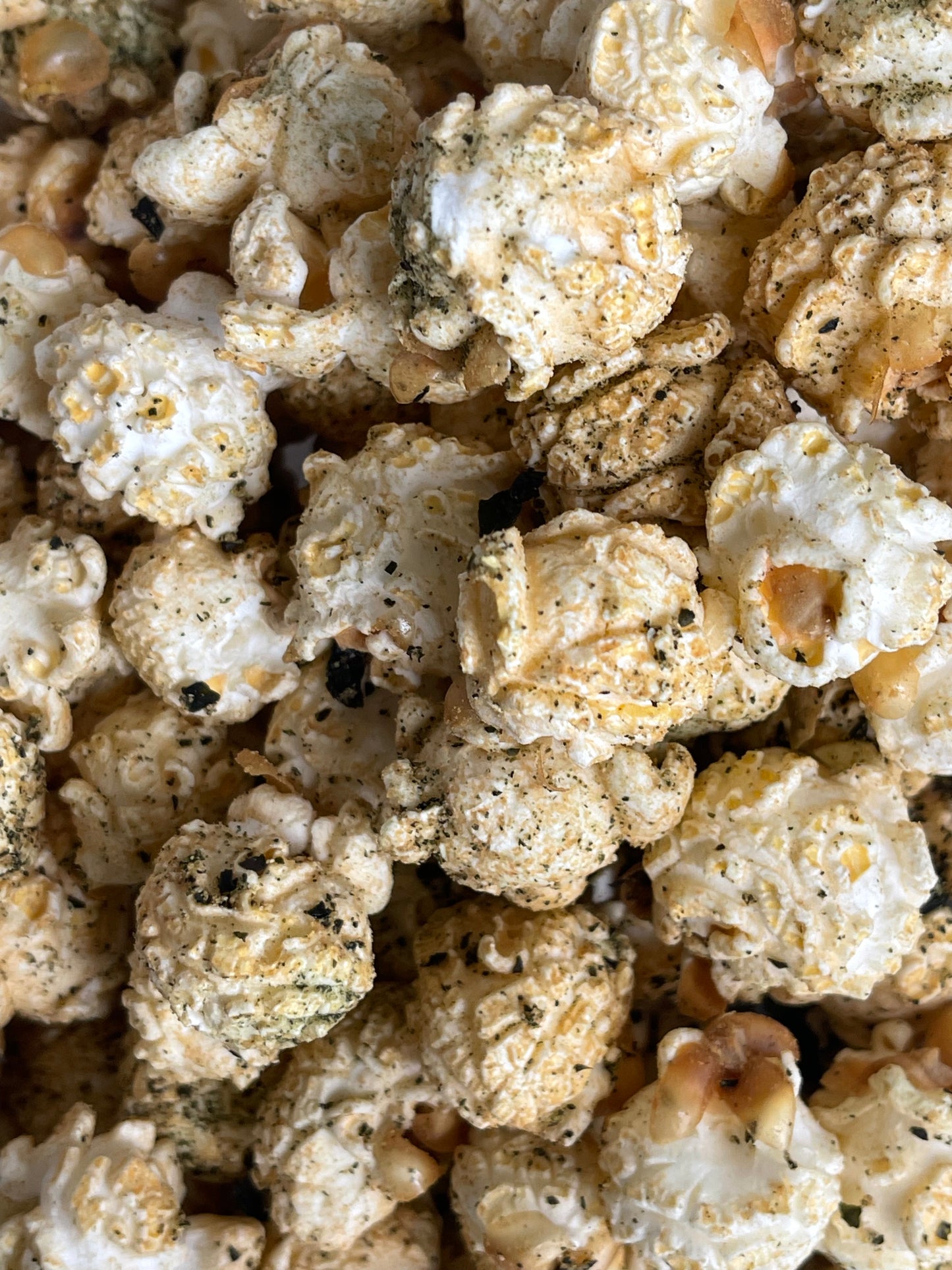 PopCorna close-up of seaweed, wasabi and soy popcorn with visible soy and seaweed seasonings